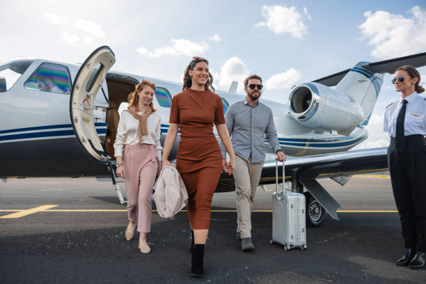 Family Disembarking From Private Jet After Vacation