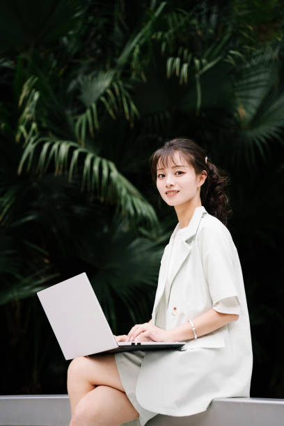 istock Asian young woman working outdoors 2193344355