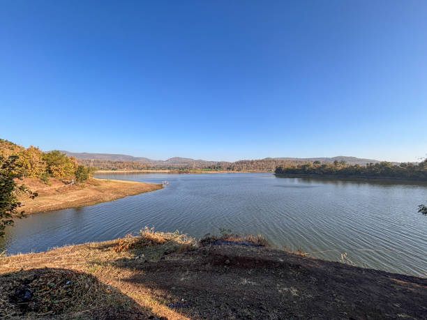 istock A calm lake with a blue sky in the background 2193347954