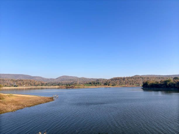 istock A calm lake with a clear blue sky above 2193347961