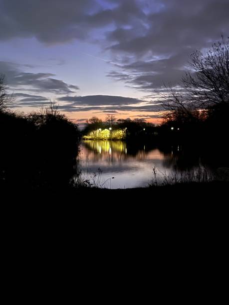 istock Lit up lake during sunrise 2193351927