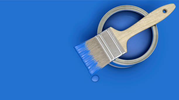 istock Blue paint can with brush on blue background 2193356796