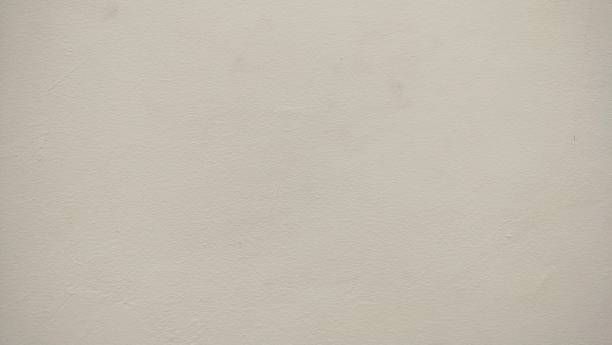istock soft brown cement wall texture background. minimalistic, neutral-toned background with a soft beige texture. The surface exudes simplicity and calmness, creating a serene and understated aesthetic 2193359206