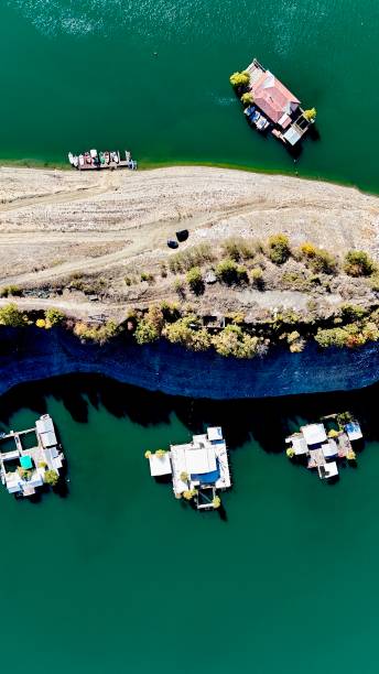 istock Fishponds on a lake shore from above 2193361369