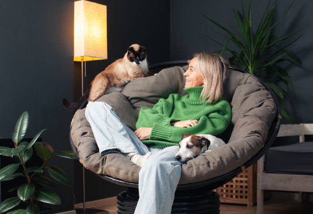 Happy girl with pets at home