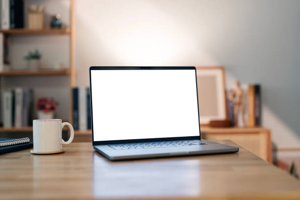 istock Open laptop with blank screen on a wooden desk in a home office 2193363686