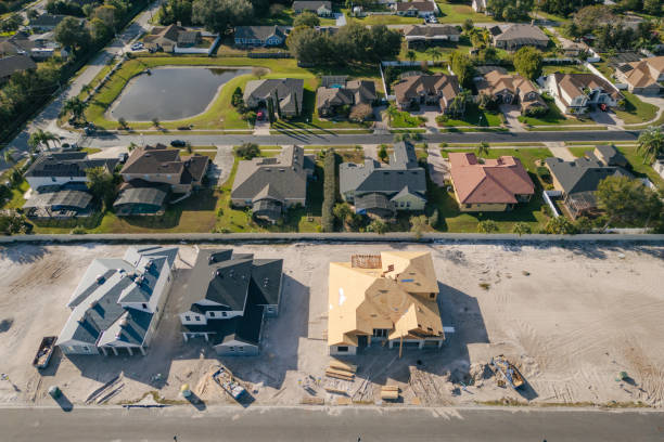istock New Construction Homes - Orlando Florida - Developing Neighborhood - Three Houses Under Construction 2193364572