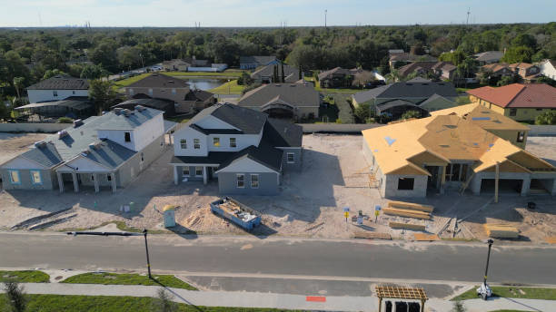 istock New Construction Homes - Orlando Florida - Developing Neighborhood - Three Houses Under Construction 2193364620