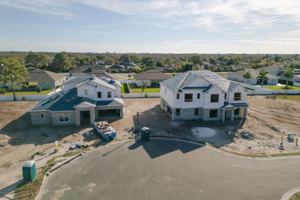 istock New Construction Homes - Orlando Florida - Developing Neighborhood - Two Houses Under Construction 2193364648