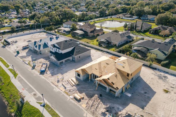 New Construction Homes - Orlando Florida - Developing Neighborhood - Three Houses Under Construction - High Angle