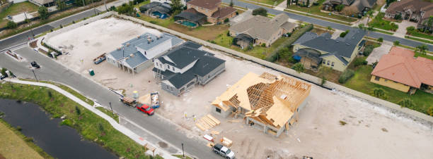 istock New Construction Homes - Orlando Florida - Developing Neighborhood - Three Houses Under Construction - Worker Adding Roof - Pano 2193364894