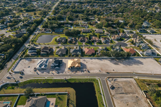istock New Construction Homes - Orlando Florida - Developing Neighborhood - Three Houses Under Construction 2193365699