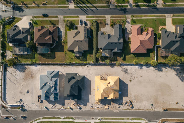 istock New Construction Homes - Orlando Florida - Developing Neighborhood - Three Houses Under Construction - Top Down 2193365781