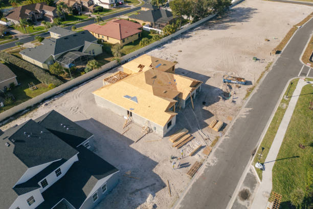 istock New Construction Home - Orlando Florida - Developing Neighborhood - House Under Construction - Roof Added 2193365835