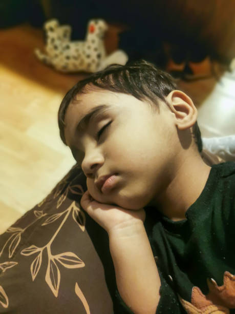 Photo of child sleeping on bedroom.