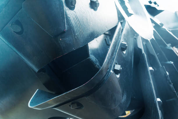 Wheel with buckets of a large, dredging vessel, close-up.
