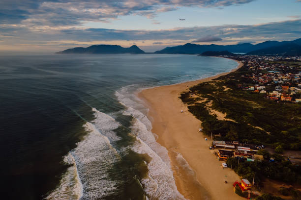 Campeche beach and ocean with waves in the morning, Florianopolis