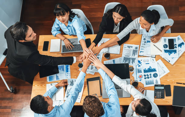 istock Multiracial business people make synergy hand stack together. Habiliment 2193374044
