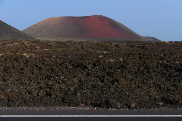 Lava fields in front of a volcano, La Geria, Lanzarote, Canary Islands