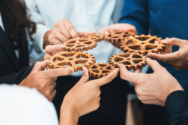 istock Business team joining cogwheel in circular together. Prudent 2193376681