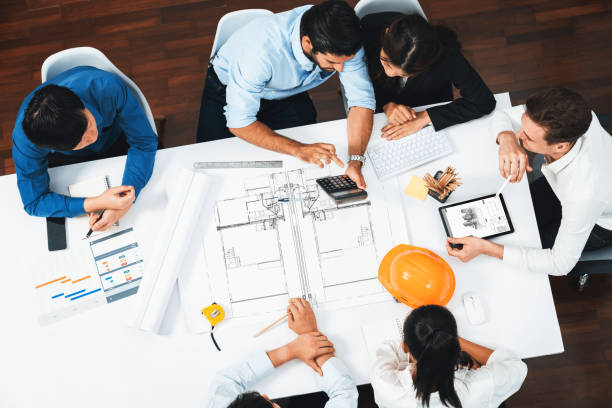 istock Diverse group of civil engineer and client working on architect. Prudent 2193378043