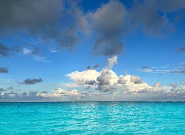 Caribbean tropical turquoise sea with dramatic perfect clouds, a perfect vacation destination in Mayan riviera