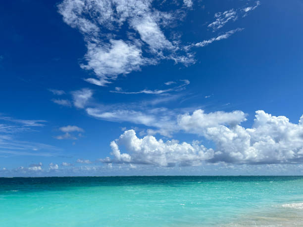 Caribbean tropical turquoise sea with dramatic perfect clouds, a perfect vacation destination in Mayan riviera
