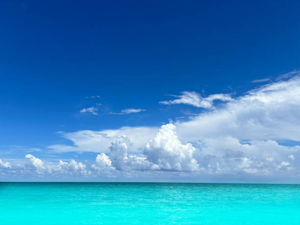 Caribbean tropical turquoise sea with dramatic perfect clouds, a perfect vacation destination in Mayan riviera