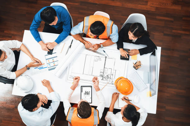 istock Diverse group of civil engineer and client working on architect. Prudent 2193379640