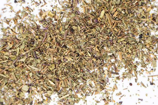 istock Dry basil spice seasoning macro texture on white background. 2193380018