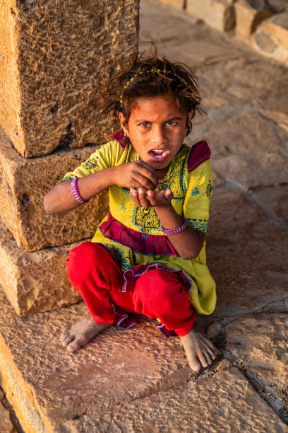 istock Poor Indian girl asking for help 2193381547