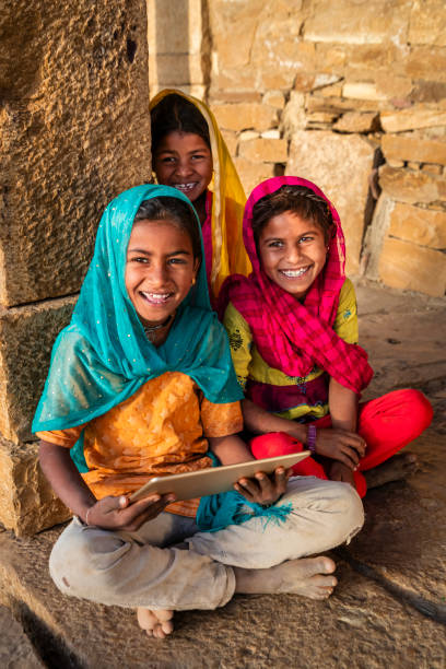 istock Happy Indian girls using a digital tablet, India 2193381665