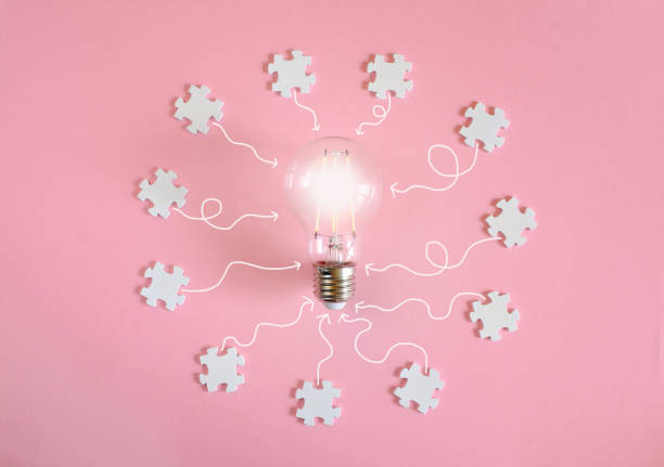 istock Business concept,collaboration,cooperation,teamwork, innovation,human resources,recruitment,team building with jigsaw puzzle pieces and lightbulb 2193385042
