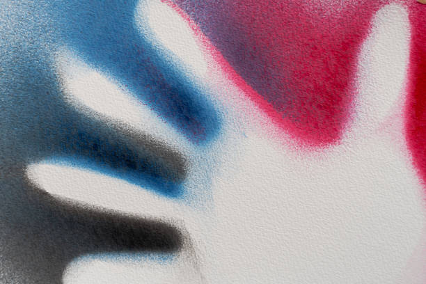 Multi colored children handprints with spanish and latin american names on a school wall in Cuba.