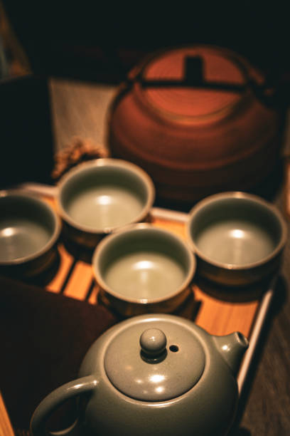 istock Tea brewing preparation with ceramic teapot and cups in a cozy setting 2193385427
