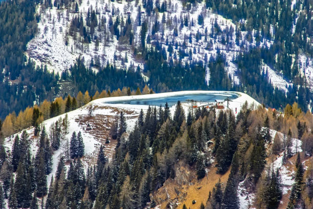 View of the snowy alpine landscape with glacier lake