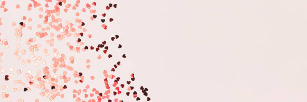 istock Banner with red confetti in a heart shape. 2193391228