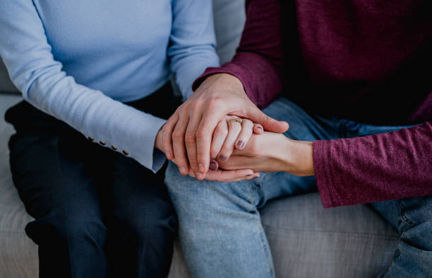 istock Couple holding hands together 2193393299