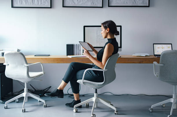 istock Young Businesswoman Working Alone in a Modern Office Environment 2193393837