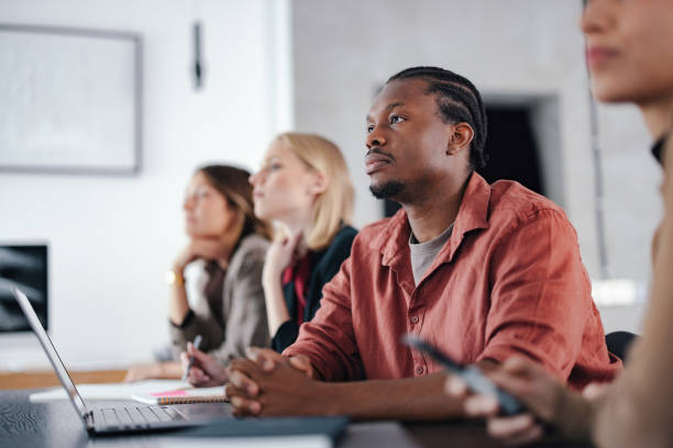 istock Group of Young Professionals in a Modern Design Studio Meeting 2193393849