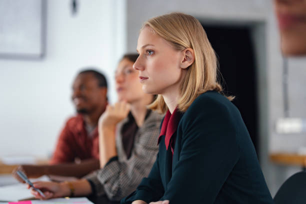 istock Young Professionals Listening During a Business Meeting in a Modern Office Setting 2193393896
