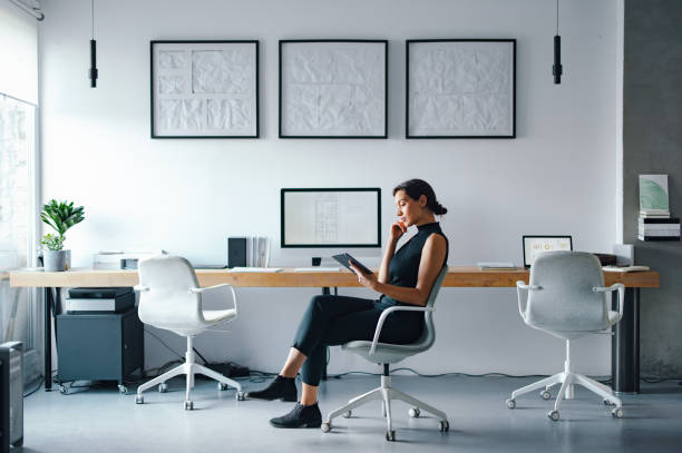 istock Focused Professional Working in a Modern Office Space with Minimal Design 2193393900