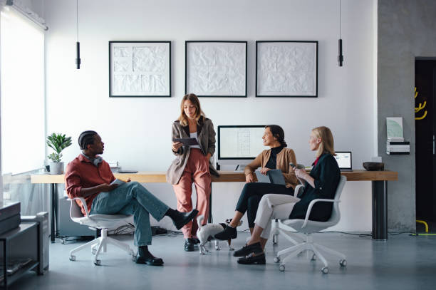 istock Young Coworkers Brainstorming Together in a Modern Design Studio 2193393909