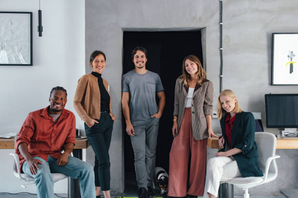 istock Group of Young Designers Collaborating in a Contemporary Workspace 2193393922