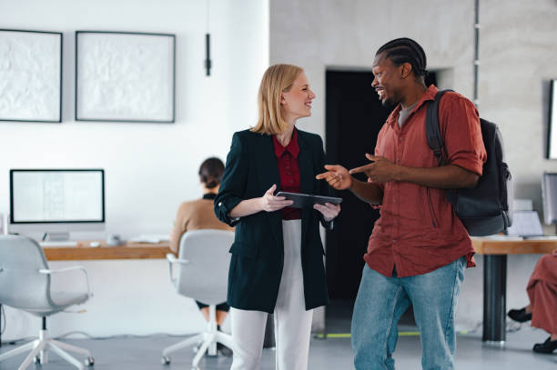 istock Young Coworkers Collaborating in a Modern Design Studio 2193393947
