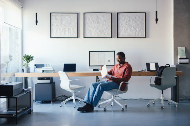 istock Young Designer Reviewing Ideas in a Modern Collaborative Studio Space 2193393953