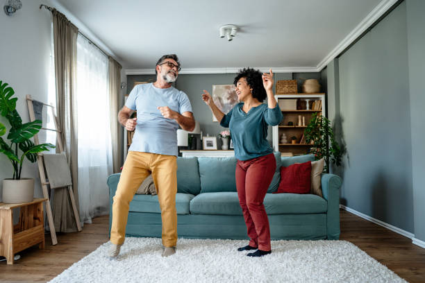 istock Mature couple dancing at home 2193396354