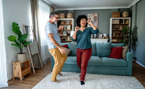 istock Joyful mature couple having fun at home 2193396403