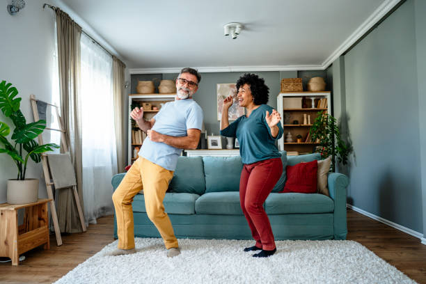 istock Mature couple dancing at home 2193396424