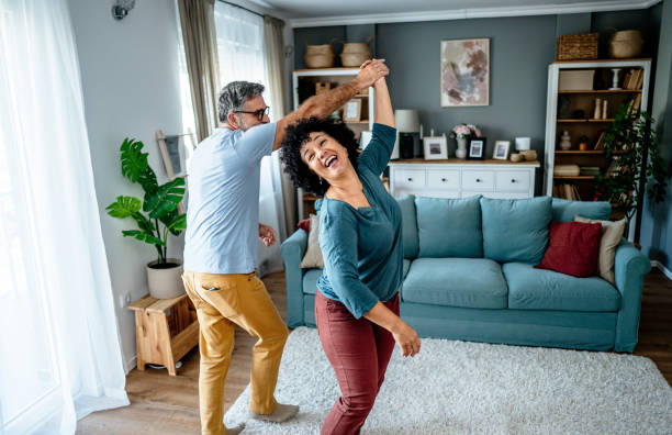 istock Joyful mature couple having fun at home 2193396447